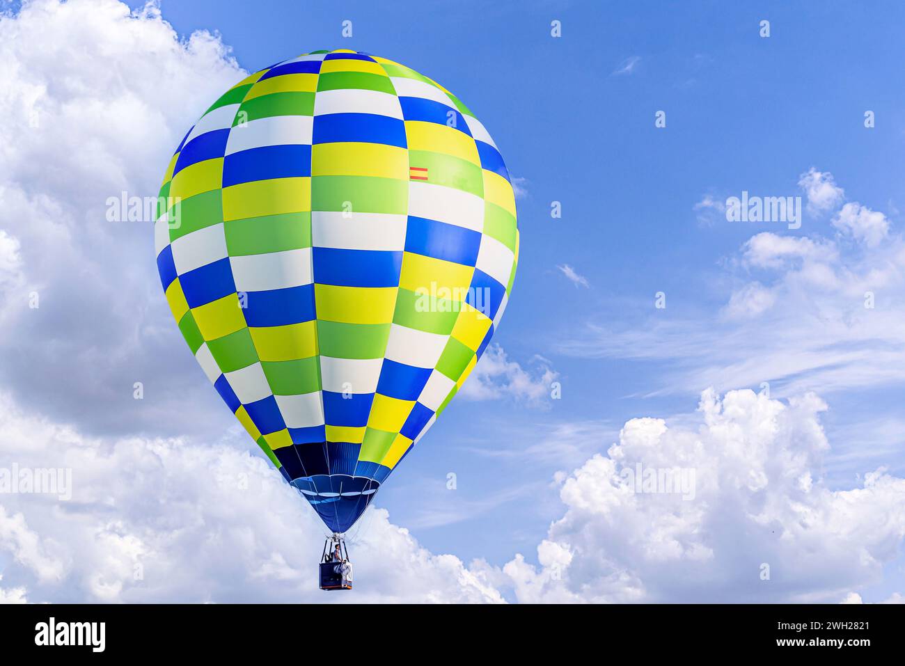 Colorful hot air balloon flying over blue sky with white cloud Stock ...