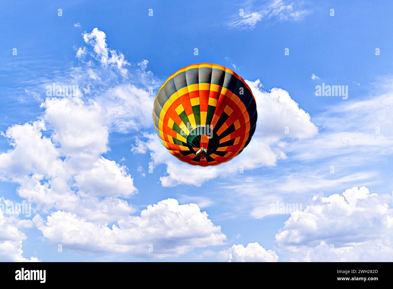 Colorful hot air balloon flying over blue sky with white cloud Stock ...
