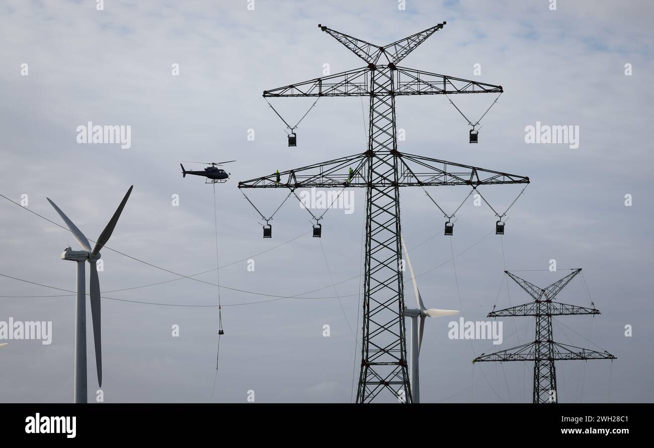 07 February 2024, Schleswig-Holstein, Pöhls: A helicopter flies between ...