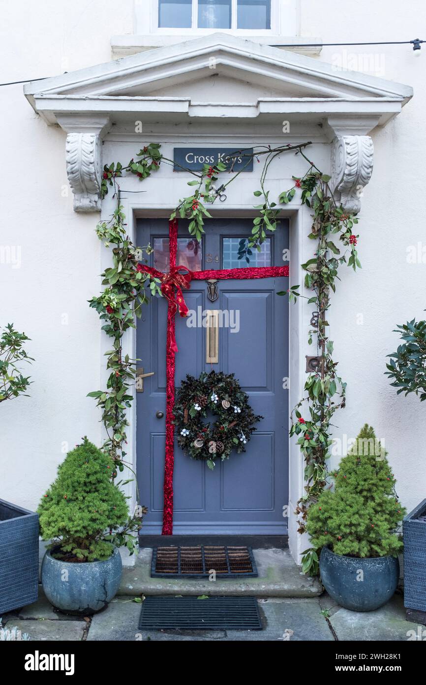Blue front door with Christmas wreath, Chipping Sodbury, Gloucestershire, UK Stock Photo