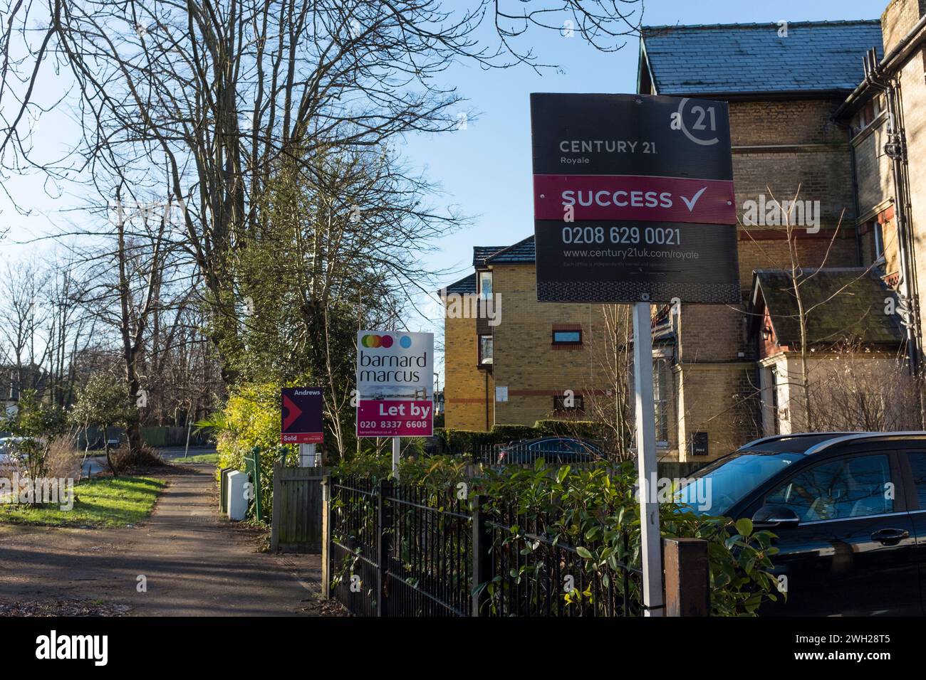 Estate Agents signs outside of properties, Worcester Park, Surrey, UK Stock Photo