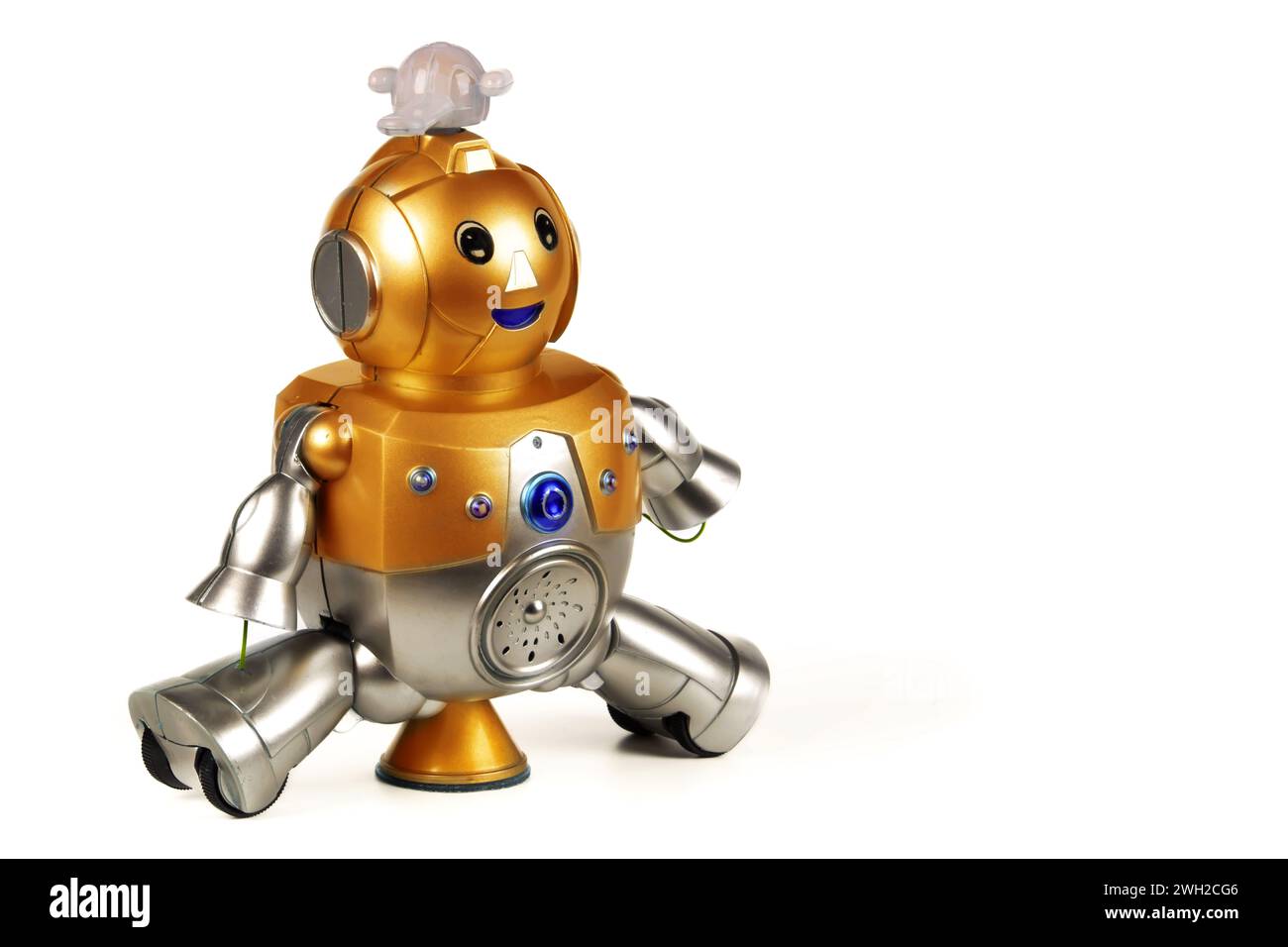 Golden toy robot isolated on white background. Dear vintage robot. Robotics. Stock Photo
