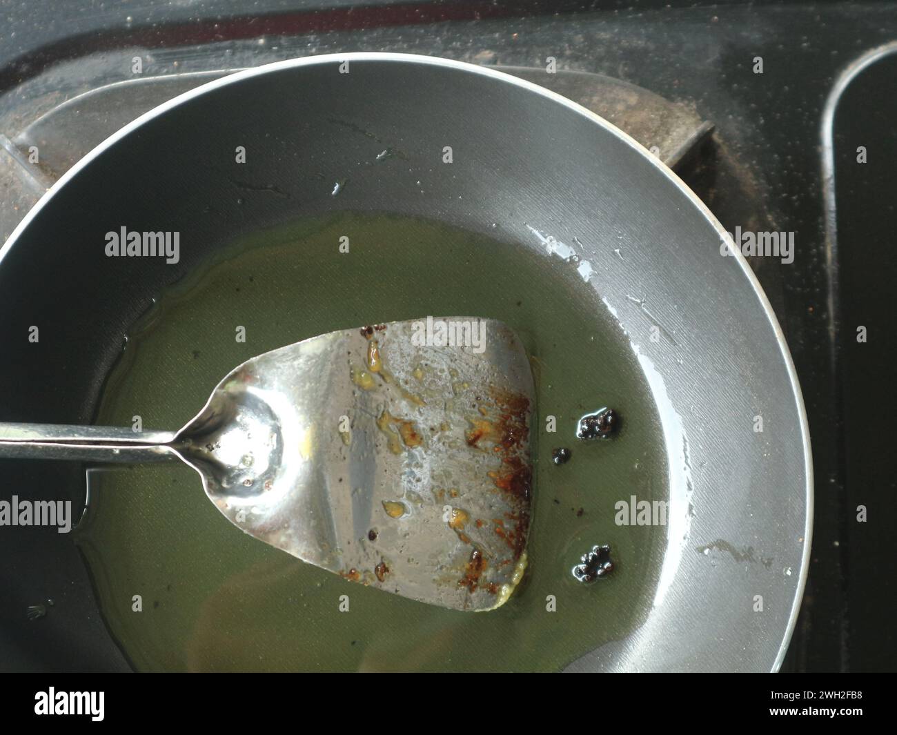 Used Cooking Oil Color The container used for frying still has used oil and a spatula left ...