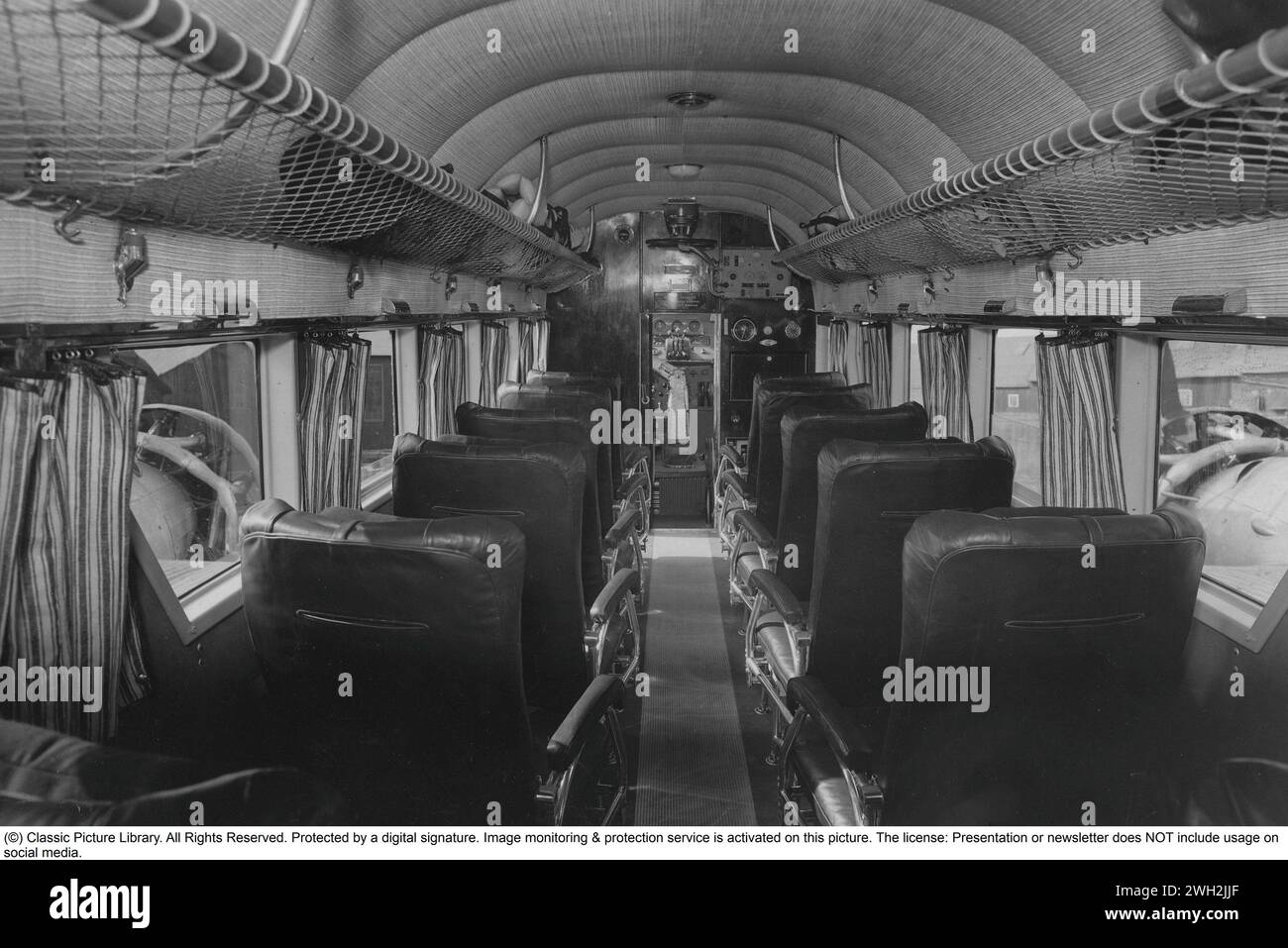 Aircraft interior of the 1930s. Interior of a Junkers Ju 52 aircraft with the cabin and seats, no passangers, 1935 Stock Photo