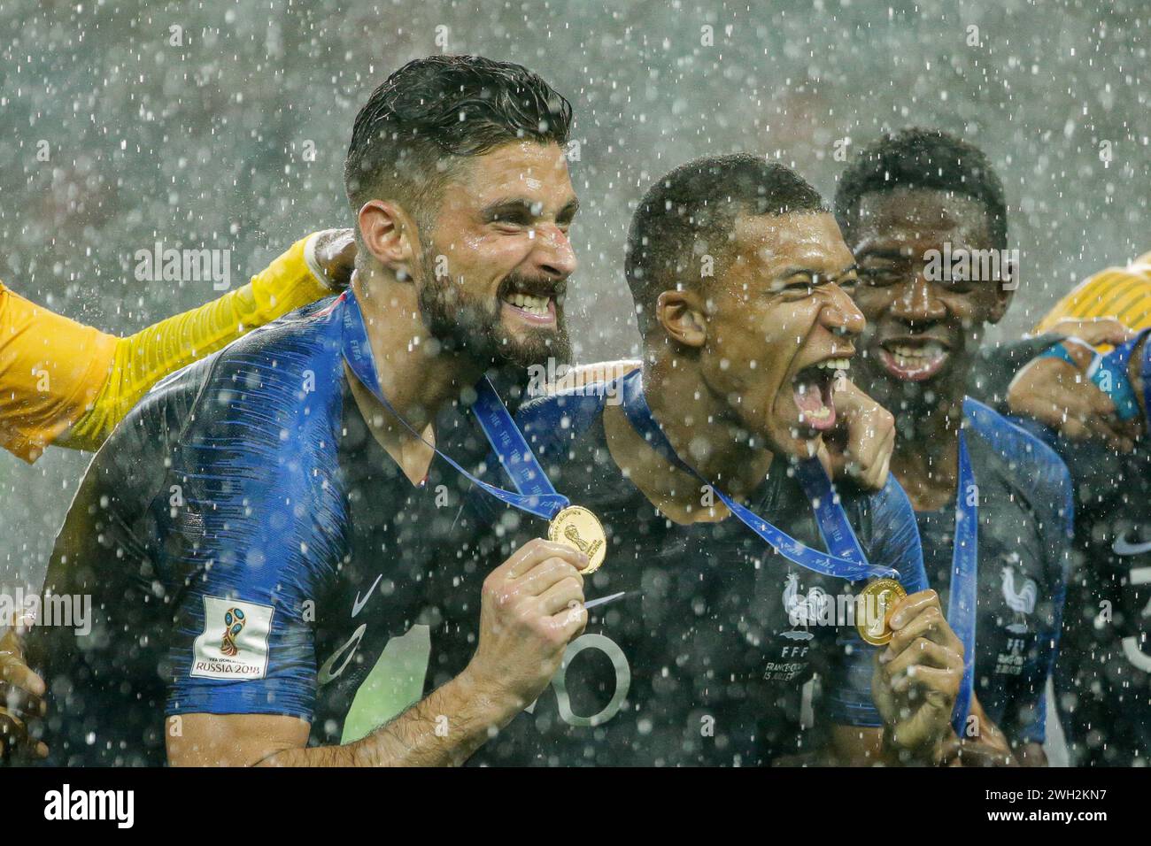 Olivier Giroud of France (L), Kylian Mbappe of France (C) and Ousmane Dembele of France (R) seen with gold medals of the world championships  during the FIFA World Cup 2018 Final match between France and Croatia at Luzhniki Stadium. Final score: France 4:2 Croatia. (Photo by Grzegorz Wajda / SOPA Images/Sipa USA) Stock Photo