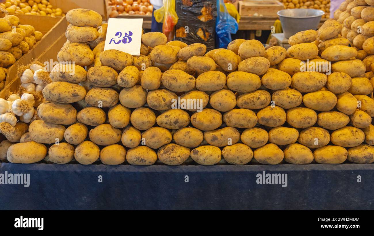 Big Pile of Big Potatoes With Price Tag at Farmers Market in Turkey Stock Photo