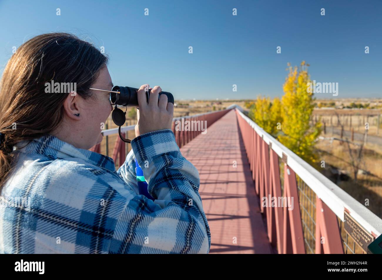 Keenesburg, Colorado - A visitor looks for animals at the Wild Animal Sanctuary, a nonprofit that rescues animals that have been abused or held illega Stock Photo