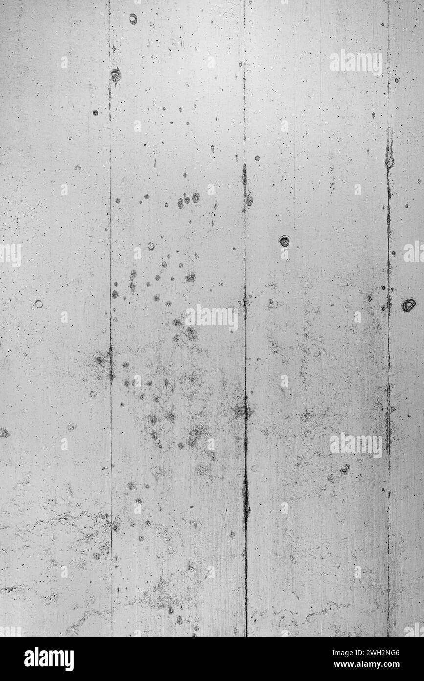 Texture of grey concrete wall where imprints of the formwork can still be seen. Stock Photo