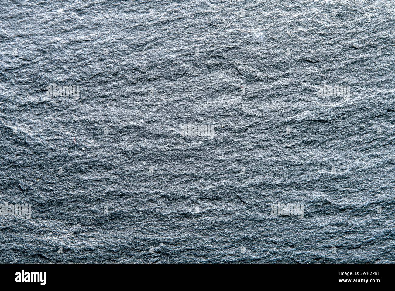 Texture of dark grey slate plate as a background. Stock Photo