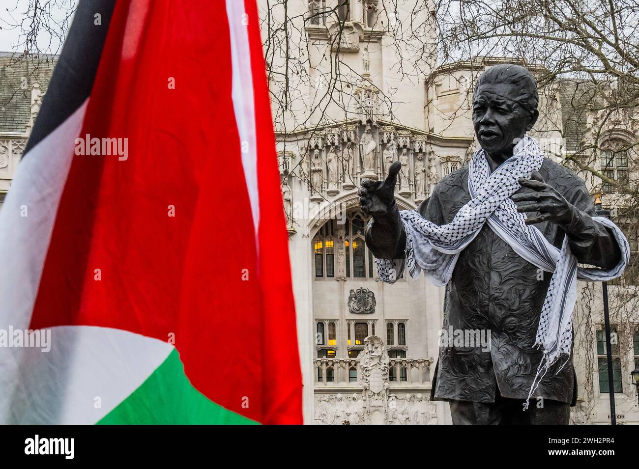 London, UK. 7th Feb, 2024. The statue of Nelson Mandela is a focal point because of his support for a free palestine - Palestine protest, calling for a Ceasefire Now and for the west to Stop arming Israel, organised by Parents for Palestine to the ongoing outbreak of violence and the Israeli response in Gaza. Credit: Guy Bell/Alamy Live News Stock Photo