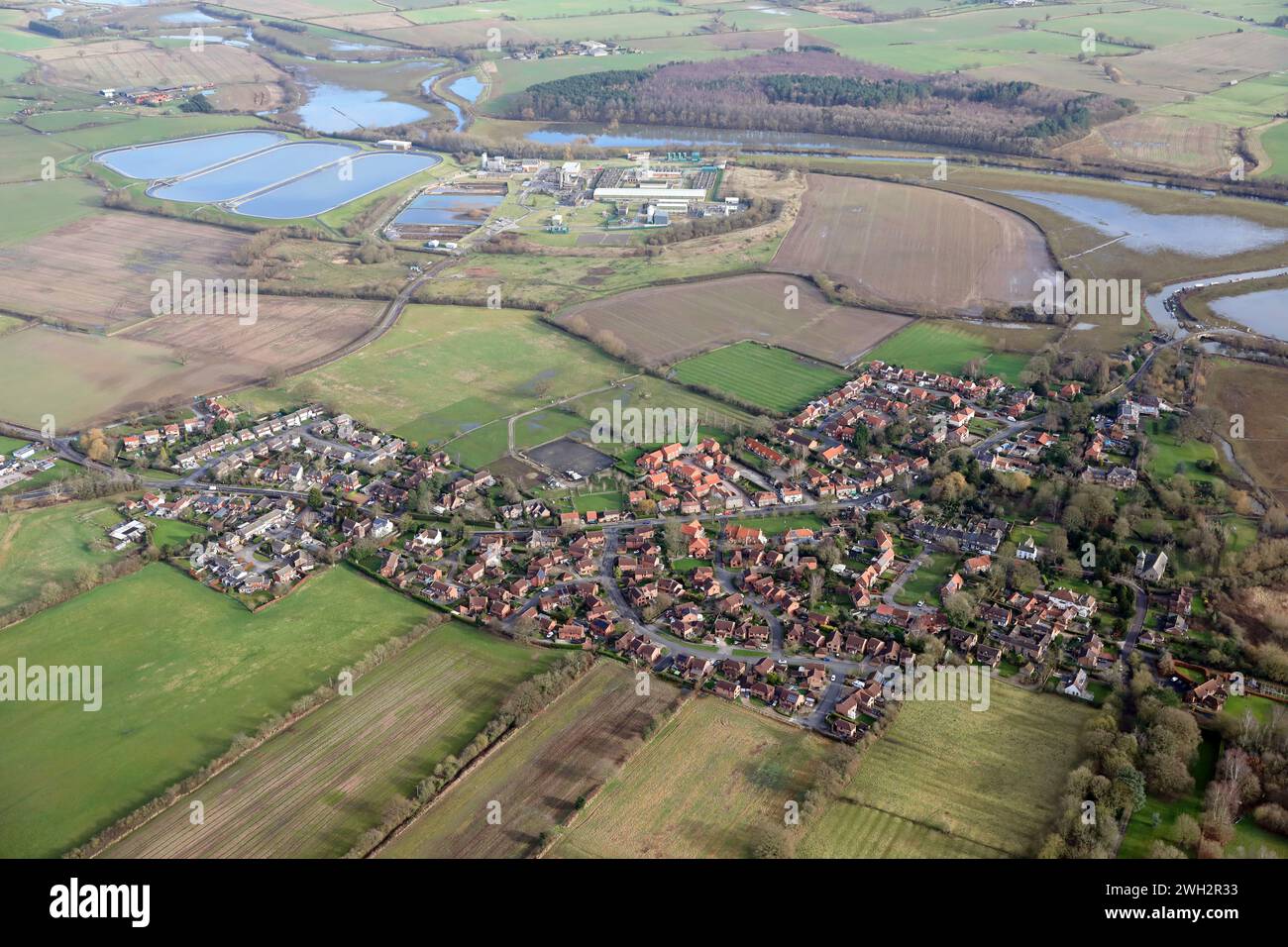 aerial view of Elvington village near York with the large water treatment works and the River Derwent in the background Stock Photo