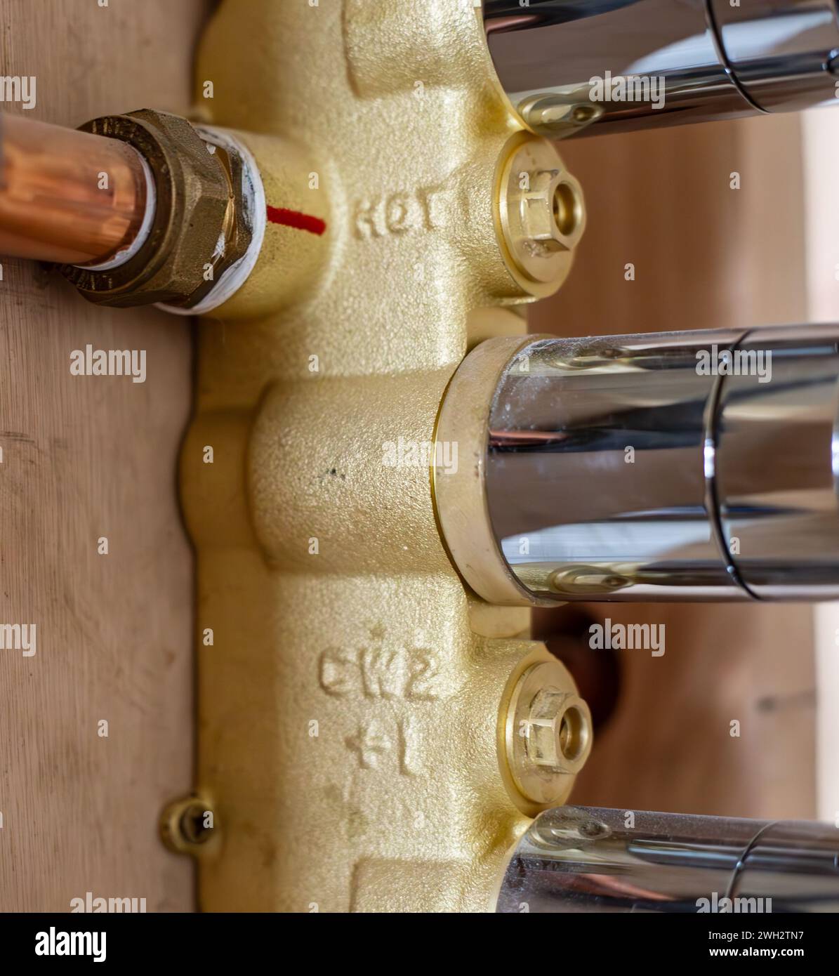 Copper hot water pipe connected to shower valve control to be hidden in
