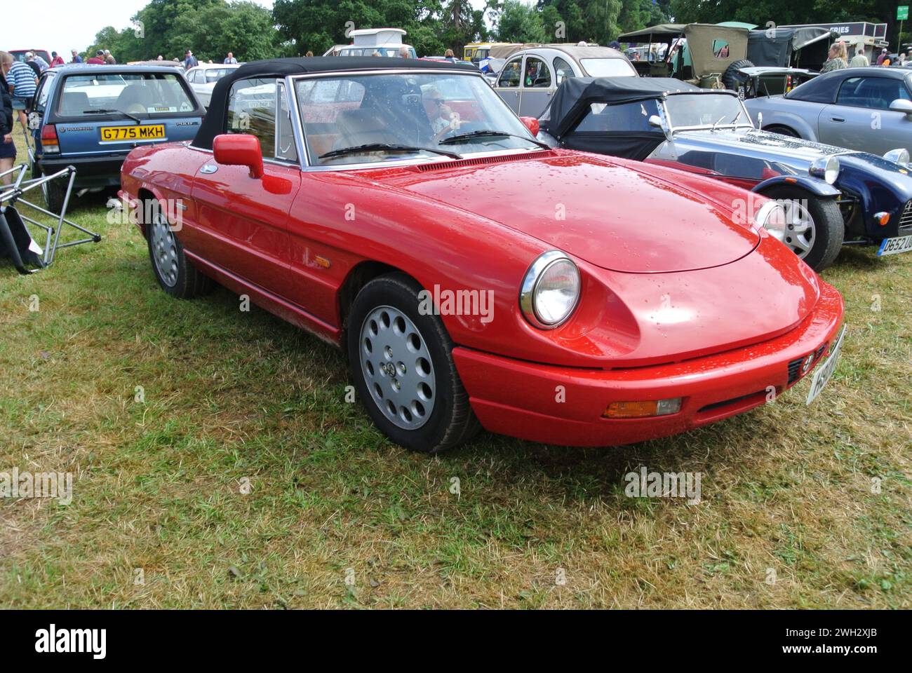 A 1990 Alfa Romeo Spider 2.0 parked on display at the 48th Historic Vehicle Gathering, Powderham, Devon, England, UK. Stock Photo