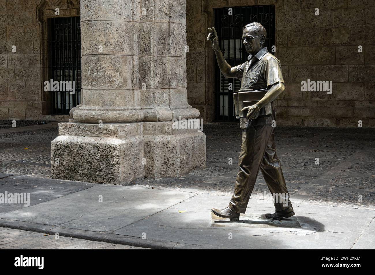 HAVANA, CUBA - AUGUST 27, 2023: Statue of Eusebio Leal Spengler historician in front of Museo de la Ciudad, Havana, Cuba Stock Photo