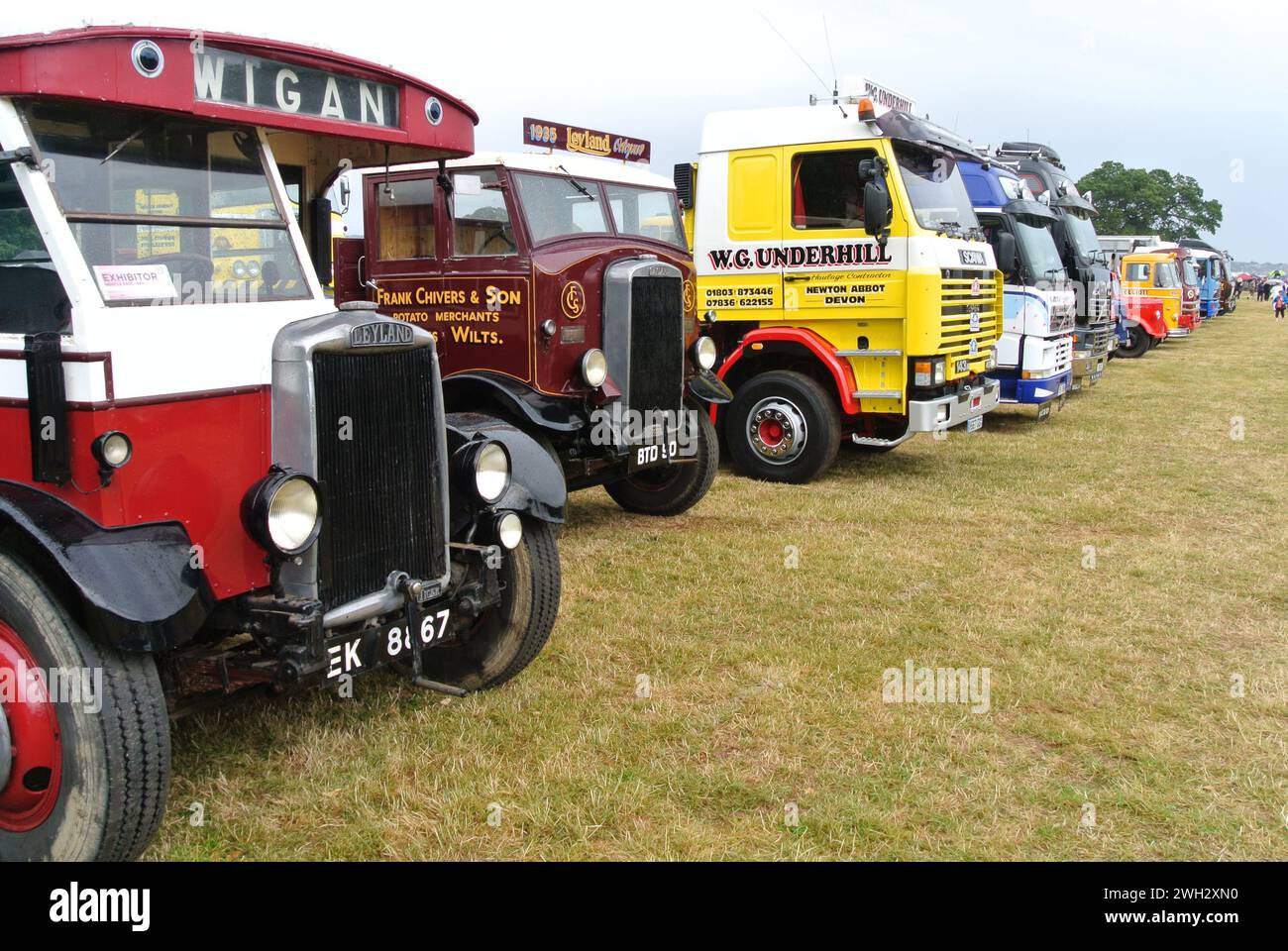 A line of classic commercial lorries parked on display at the 48th Historic Vehicle Gathering classic car show, Powderham, Devon, England, UK. Stock Photo
