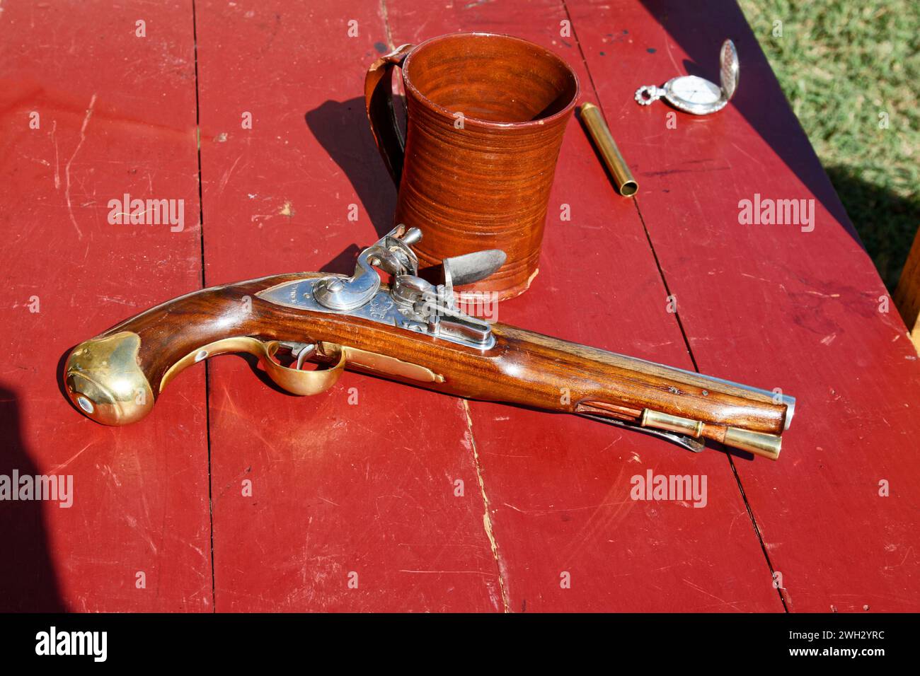 colonial pistol, British made, red table, troop reenactment, weapon