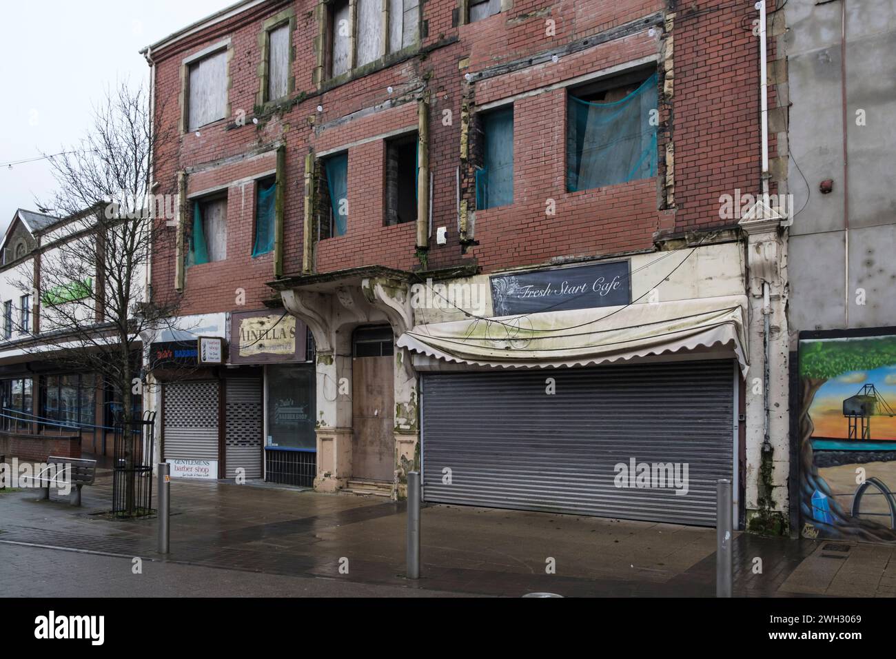 Around Port Talbot an industrial town in Neath Port Talbot Wales UK on a winters day. Dilapidated empty shops Stock Photo