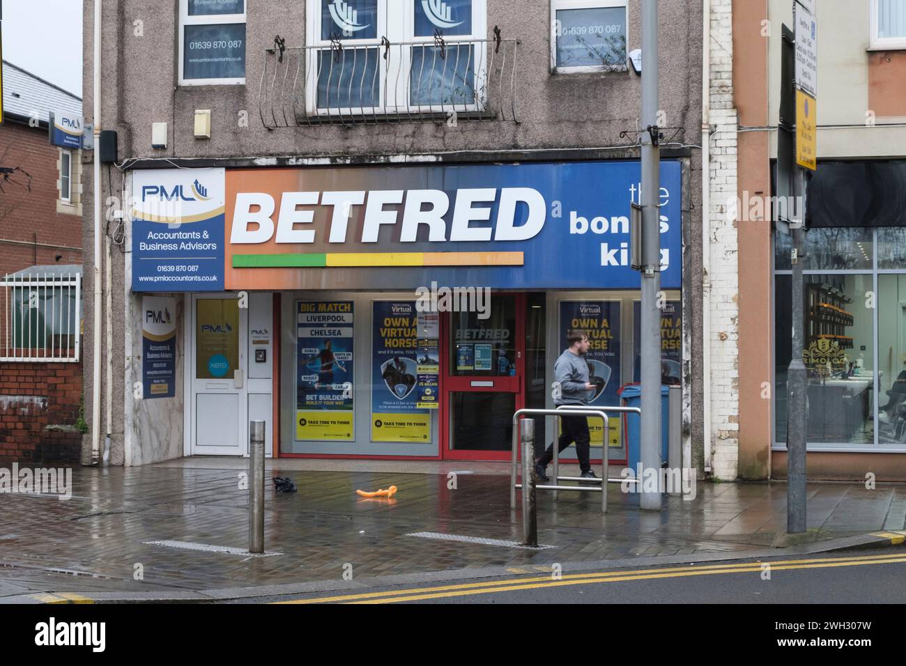 Around Port Talbot an industrial town in Neath Port Talbot Wales UK on a winters day. Betfred Betting shop Stock Photo
