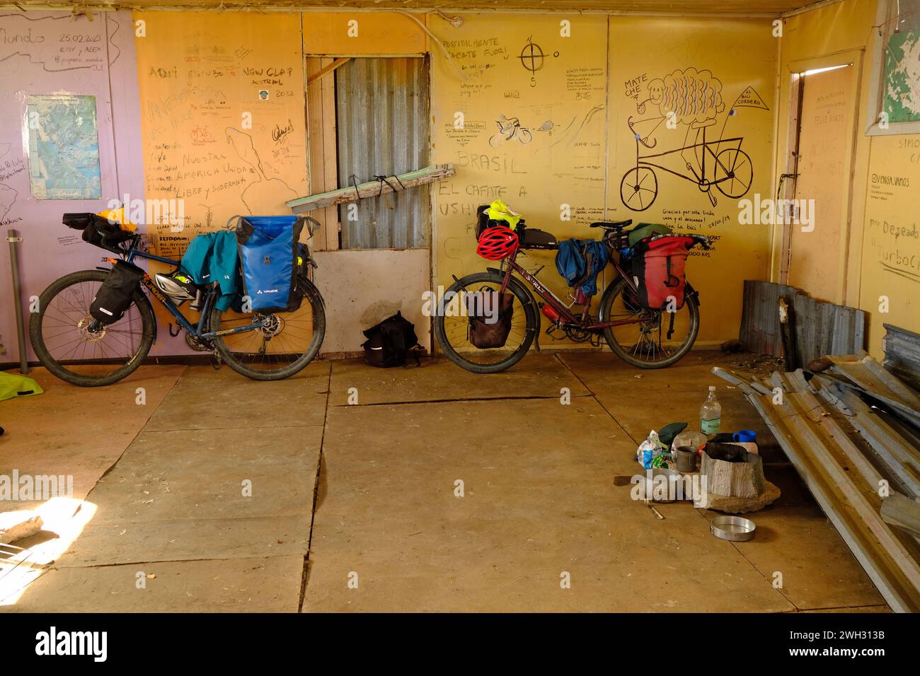 While riding in Patagonia, many cyclists seek overnight refuge from the wind in abandoned buildings. These acquire records of journeys on the walls. Stock Photo