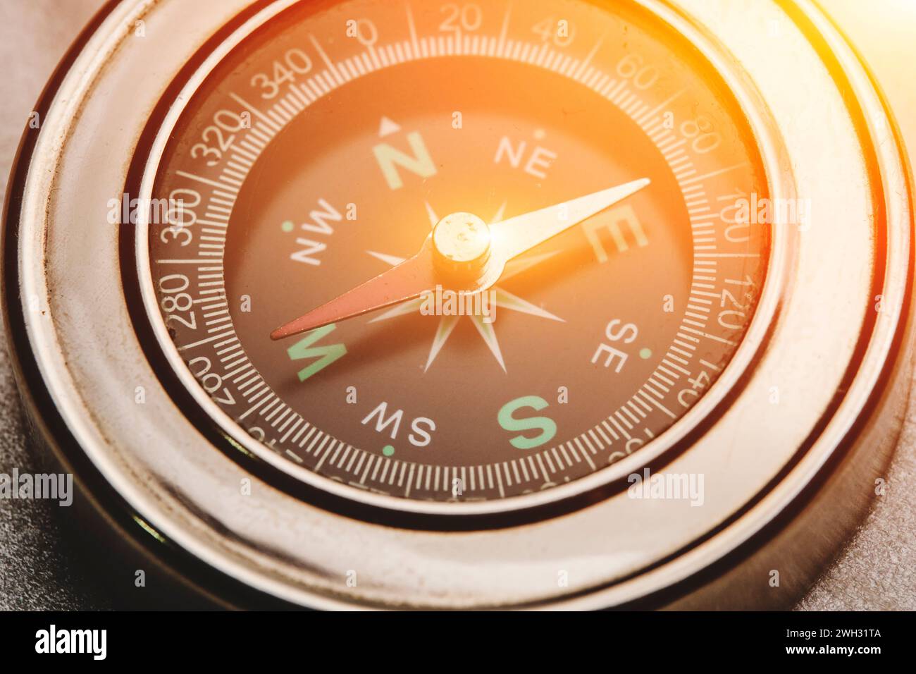 Compass with solar flare pointing west Stock Photo