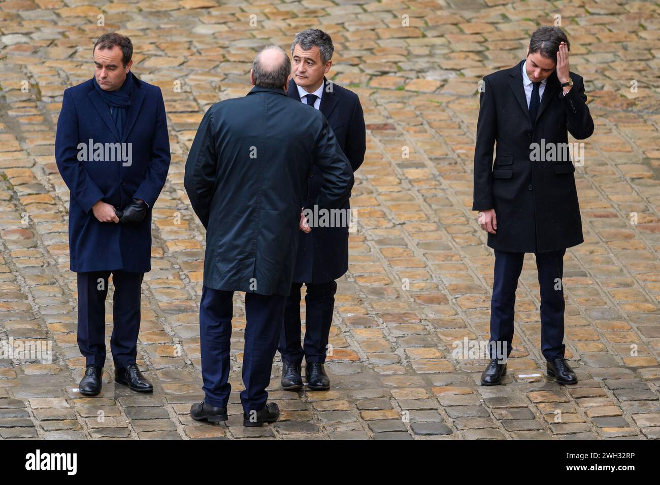 Julien Mattia/Le Pictorium - National Tribute to the Victims of the Hamas Attacks in Israel - 07/02/2024 - France/Ile-de-France (region)/Paris - Arrival of President of the Republic, Emmanuel Macron welcomed by the Ministers, Le Ministre de l'Interieur et des Outre-mer, Gerald Darmanin, Le Premiere Ministre, Gabriel Attal, Le Ministre de la Justice, et garde des Sceaux, Eric dupond-Moretti and Le Ministre des Affaires Etrangeres Stephane Sejourne at the ceremony to honor the French victims of the October 7 terrorist attacks in Israel, at Les Invalides, February 7, 2024. Stock Photo