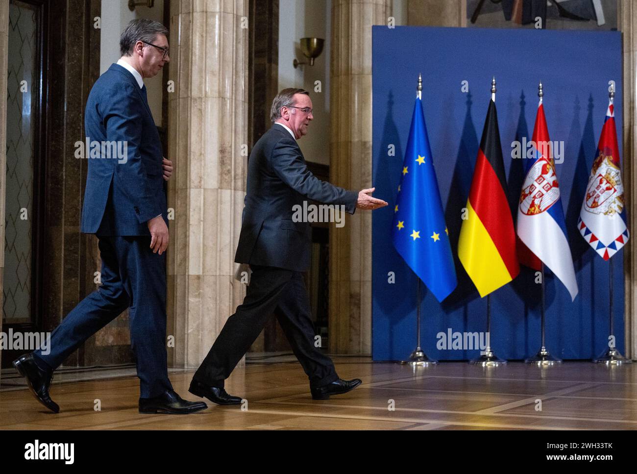 Belgrad, Serbia. 07th Feb, 2024. Boris Pistorius (r, SPD), Federal Minister of Defense, and Aleksandar Vucic (l), President of Serbia, attend a joint press conference after their talks. The flags of the EU (l-r), the Federal Republic of Germany, Serbia and Montenegro stand in front of a blue wall. Credit: Soeren Stache/dpa/Alamy Live News Stock Photo
