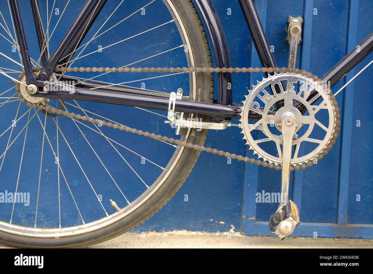 A well maintained Phoenix bicycle with a gleaming chain ring. Phoenix bicycles are made in China and exported worldwide Stock Photo