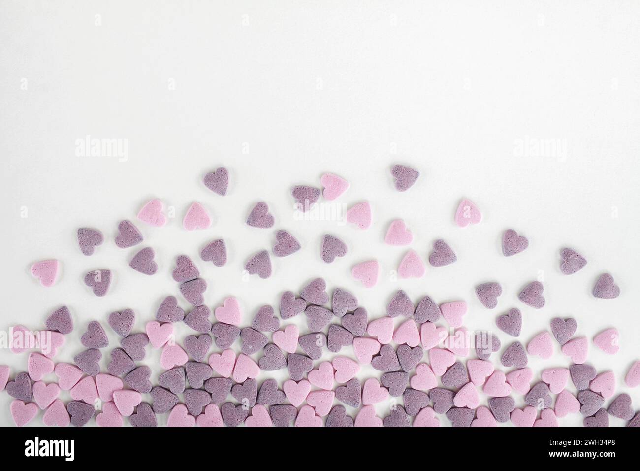 Colorful sugar sprinkles on white background Stock Photo