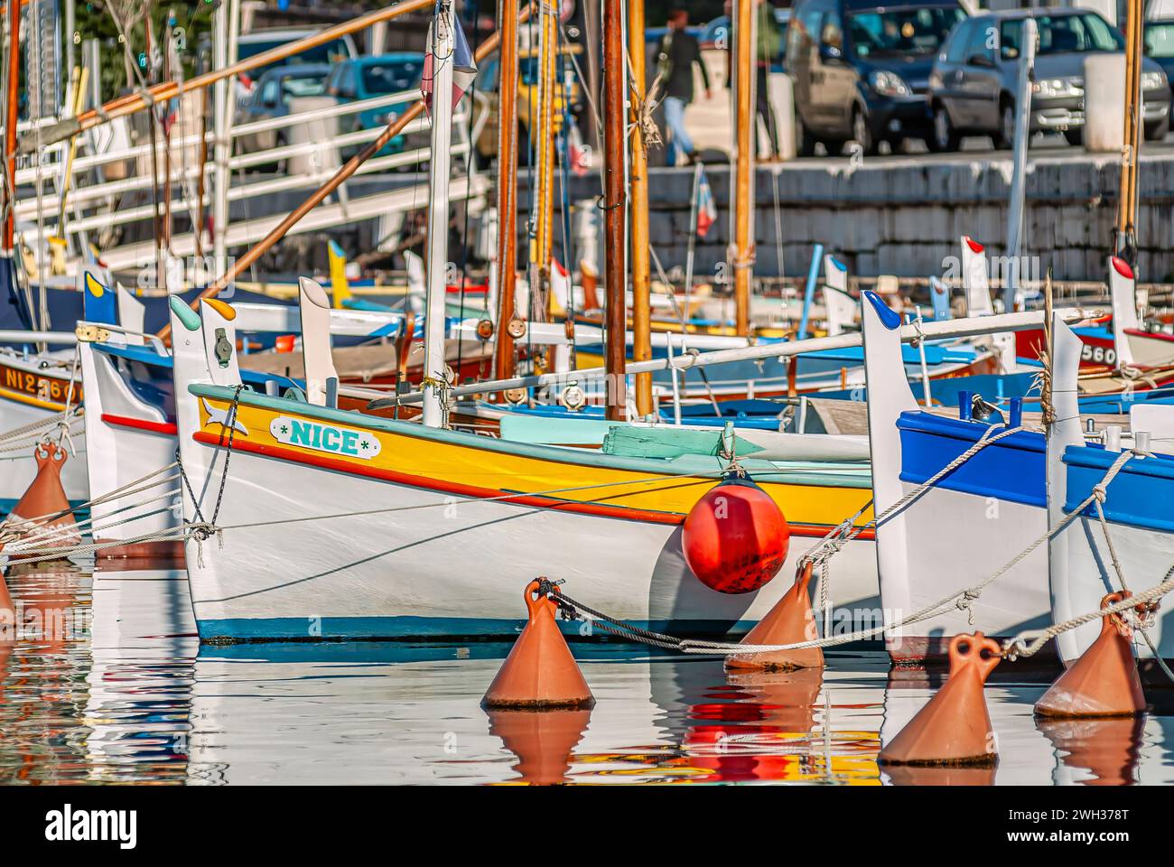 Small colourful traditional Fishing boats named Nice in the harbour of Nice, France Stock Photo