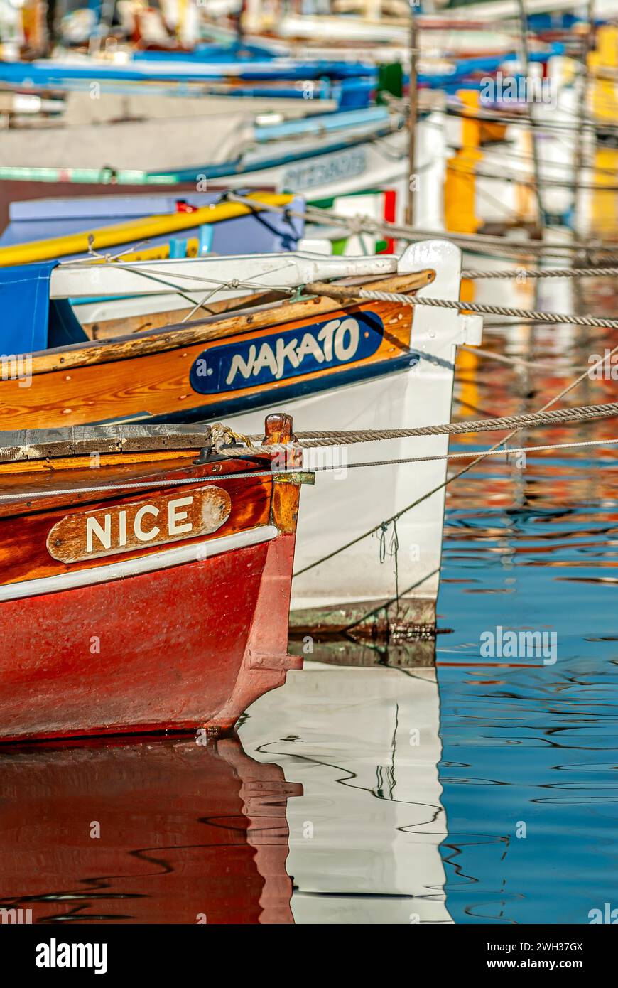 Small colourful traditional Fishing boats named Nice in the harbour of Nice, France Stock Photo