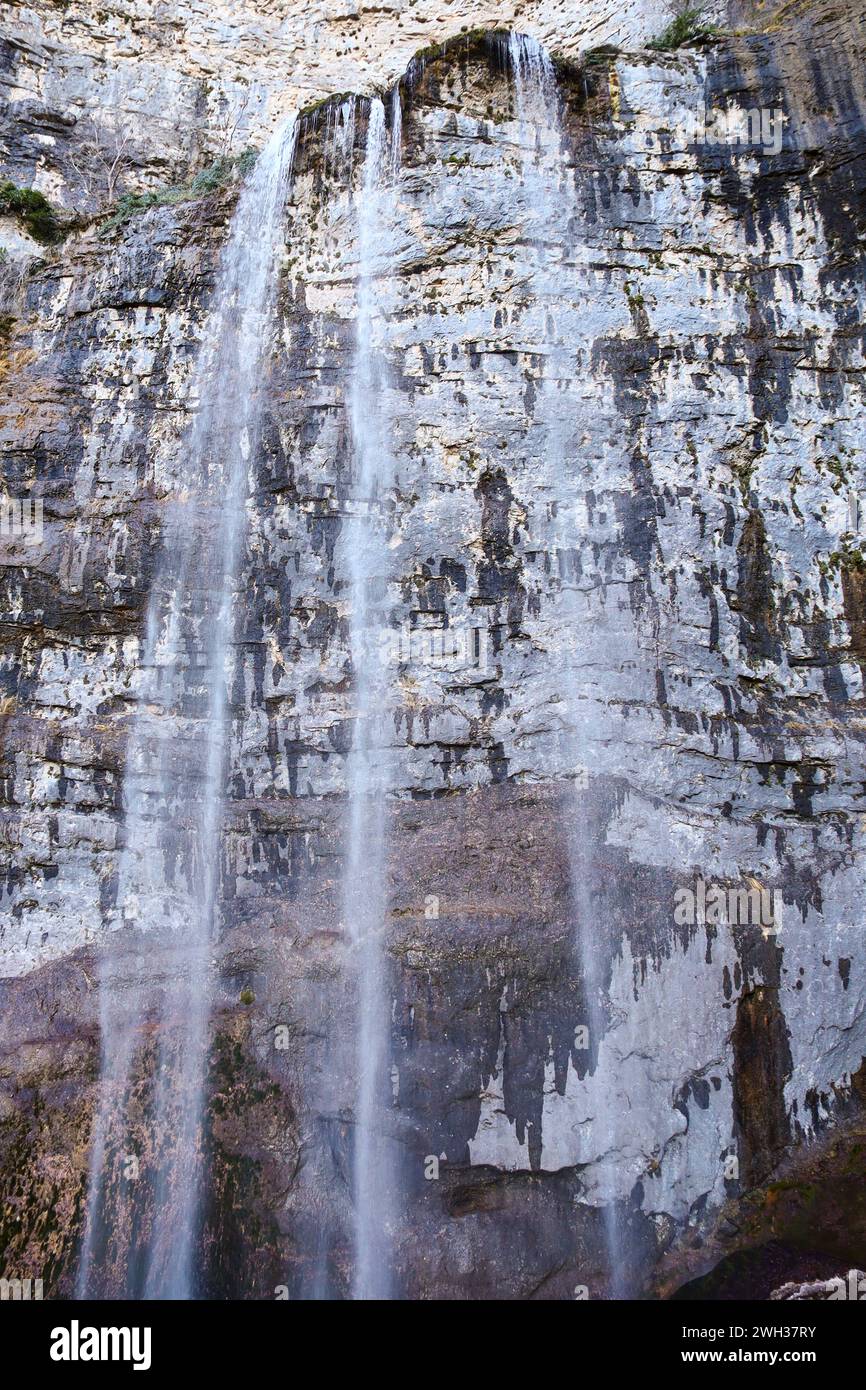 Waterfall with colorful rock wall in Nacimiento del Rio Mundo in Sierra de Alcaraz, Albacete province, Spain Stock Photo