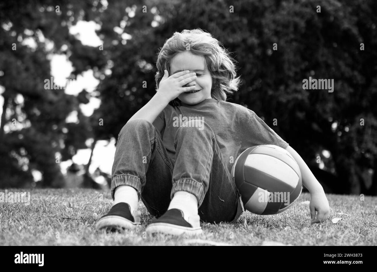 Little boy alone, lonely with ball. Loneliness kids. Stock Photo