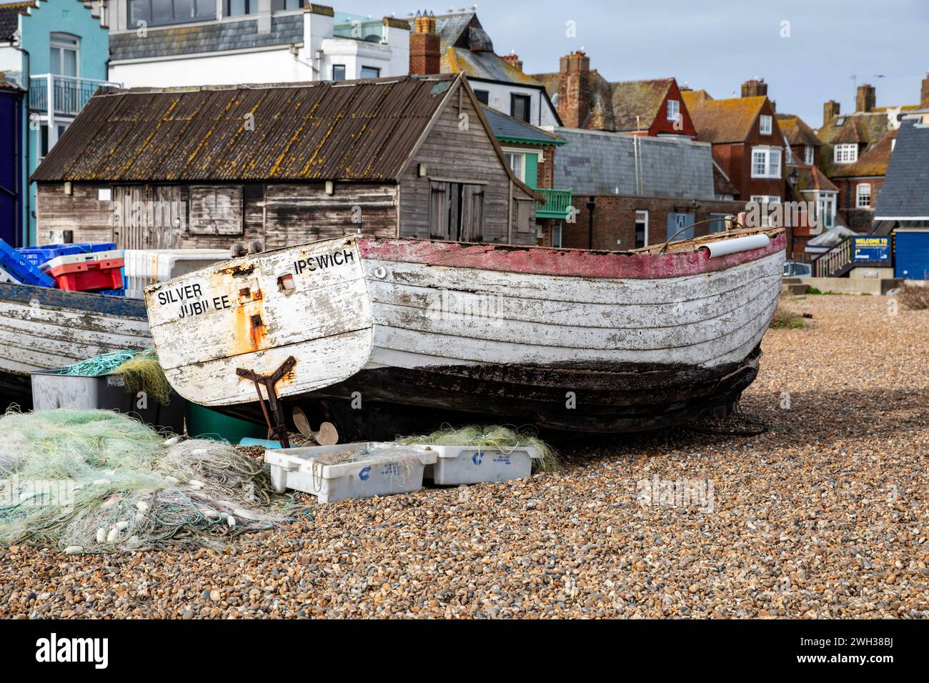 Aldeburgh, Suffolk,7th February 2024, After recent heavy downpours of rain the sky was cloudy and 7C in Aldeburgh, Suffolk, the forecast is for rain for the next few days. A fishing boat sits on the beach.Credit: Keith Larby/Alamy Live News Stock Photo