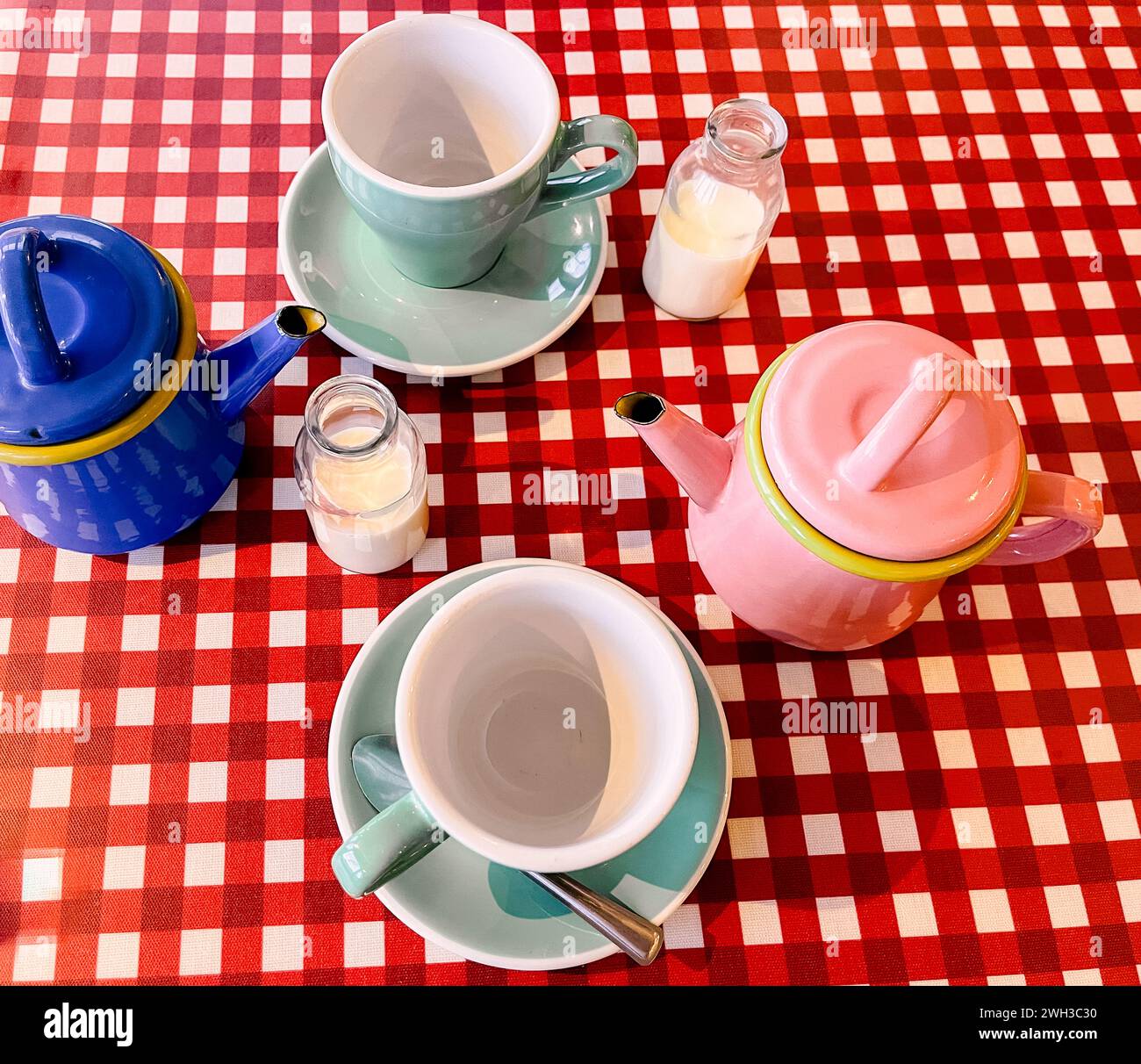 Colourful teapots and crockery in a Cotswolds in England Stock