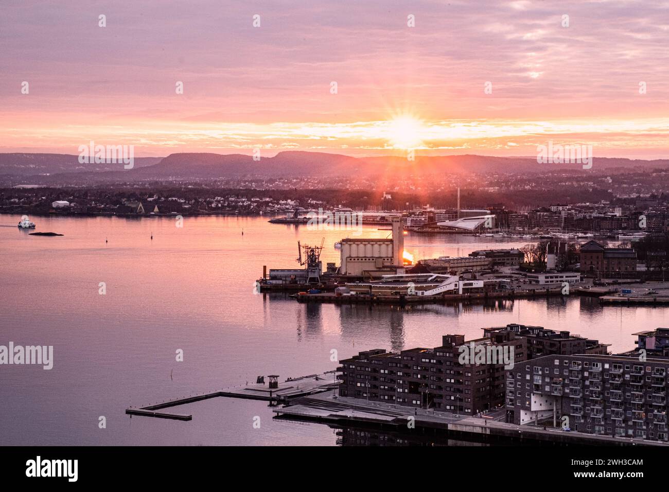 The harbour area of the city of Oslo in Norway at sunset from Ekeberg park viewpoint. Stock Photo