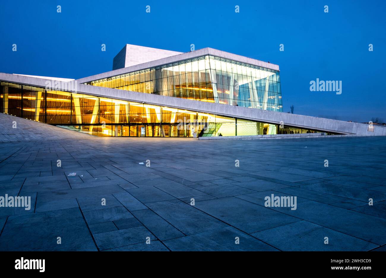 The contemporary angles of the Norwegian Oslo opera house in the harbour at dusk. Stock Photo