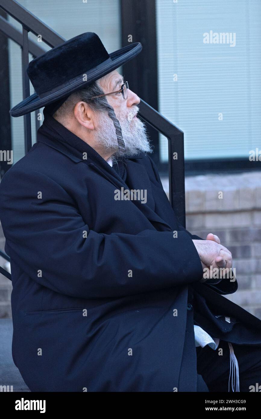 Profile photo of an orthodox Jewish man with a beard and long curly peyus. In Brooklyn, New York. Stock Photo