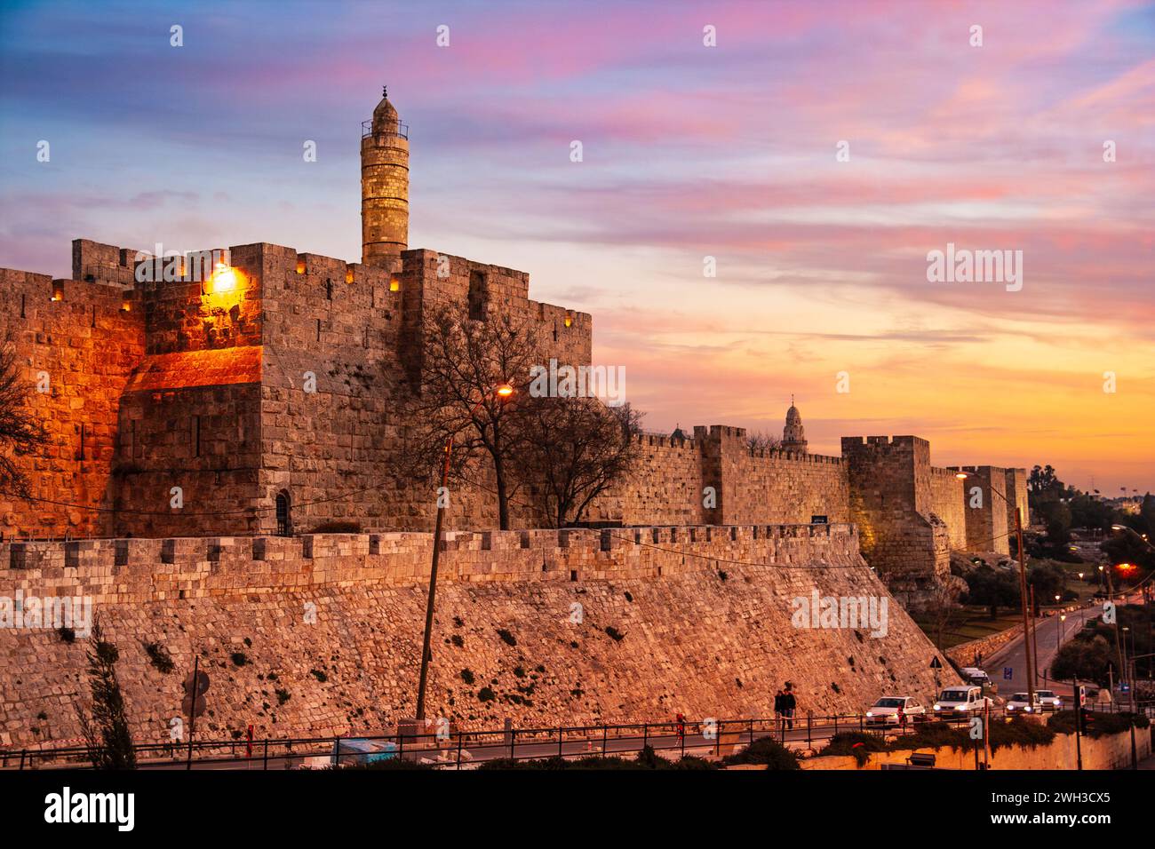 View of the old city wall of Jerusalem on the Tower of David and traffic around the city centre. Jerusalem, Israel - Jan 24, 2011 Stock Photo