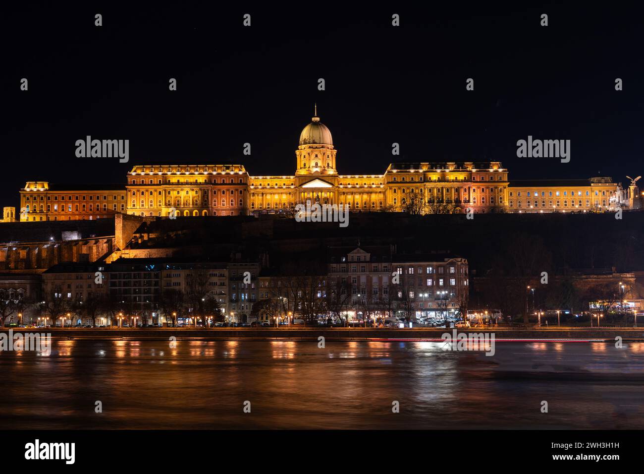 The historical Buda castle district above the Danube river illuminated ...