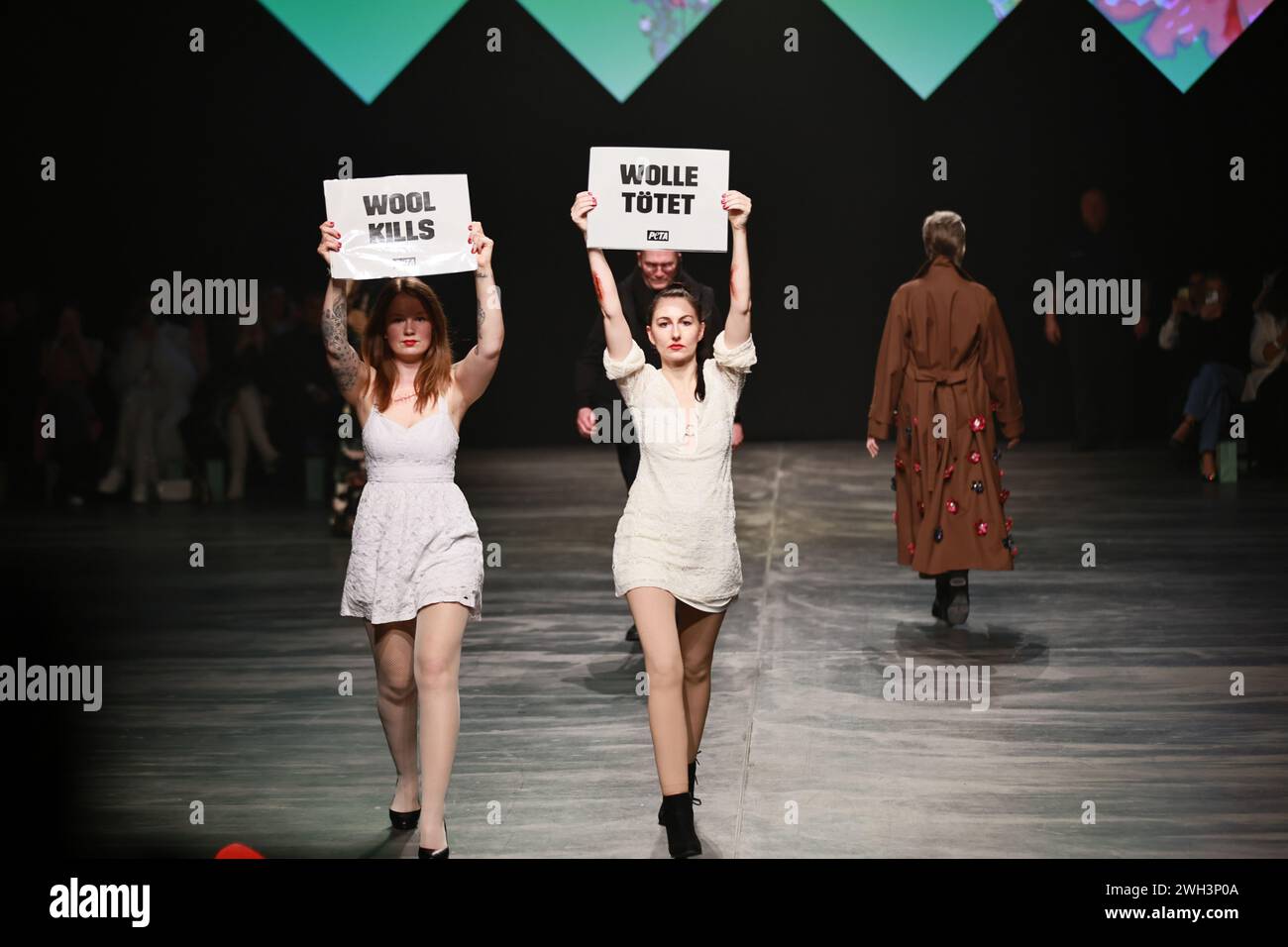 BERLIN, GERMANY - February 7th: Activists from the animal protection organization PETA run onto the catwalk during Marcel Ostertag's runway show at Verti Music Hall on February 7th, 2024 in Berlin, Germany. Stock Photo