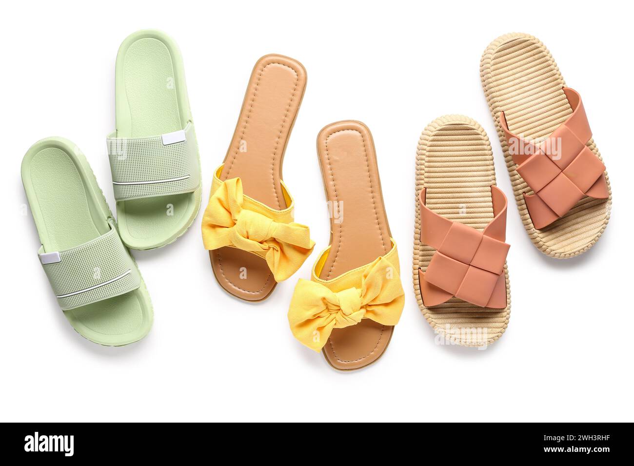 Colorful pairs of female flip flops on white background Stock Photo - Alamy
