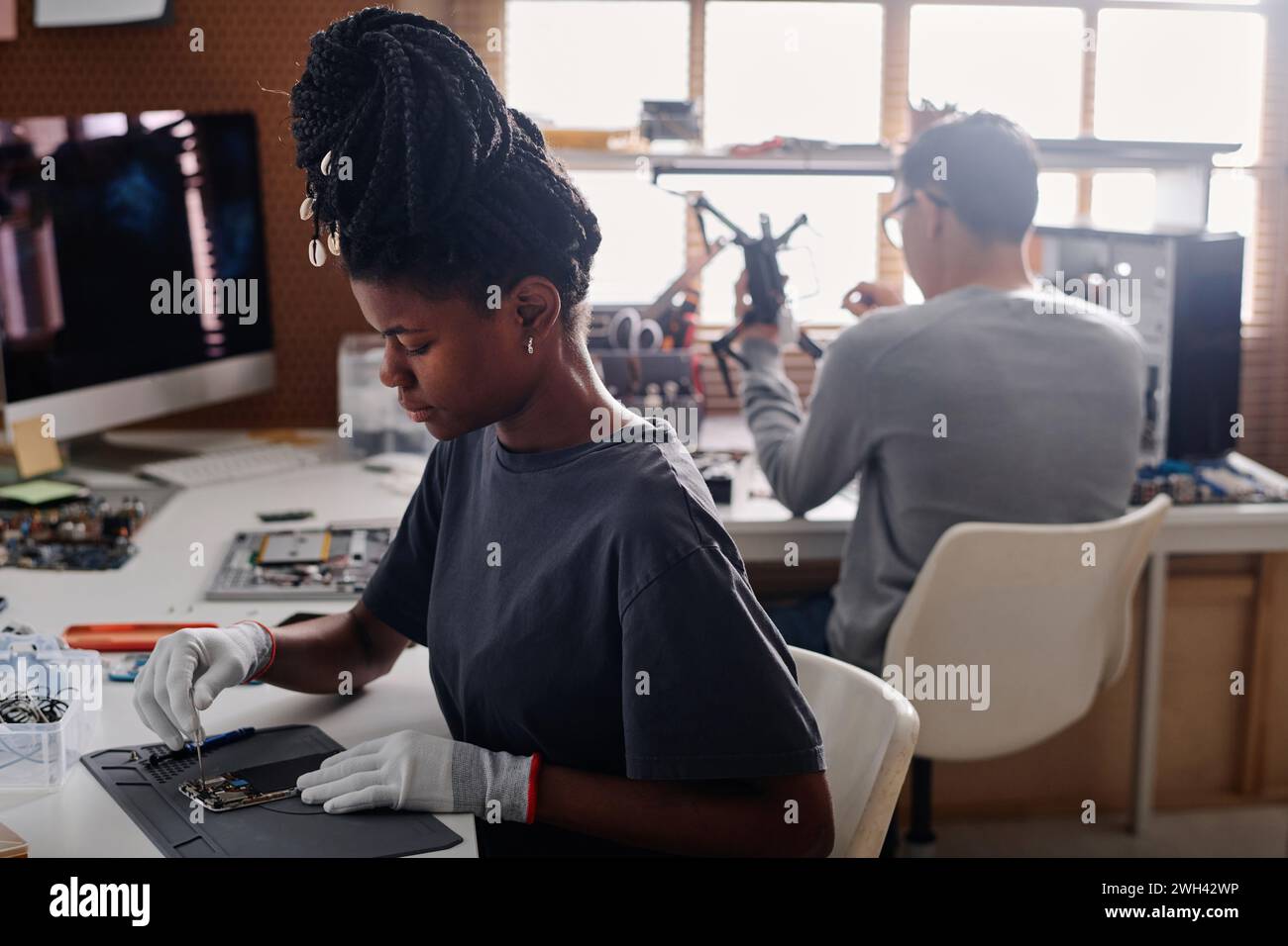 Black woman braids repairing hi-res stock photography and images - Alamy