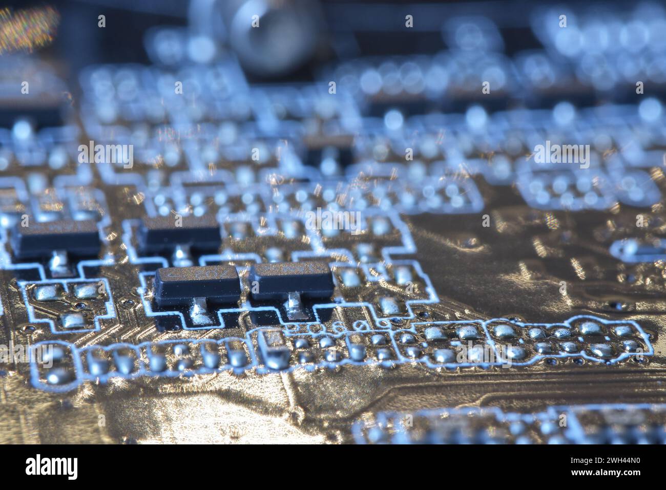 Macro shot of motherboard components with transistors chip. Motherboard