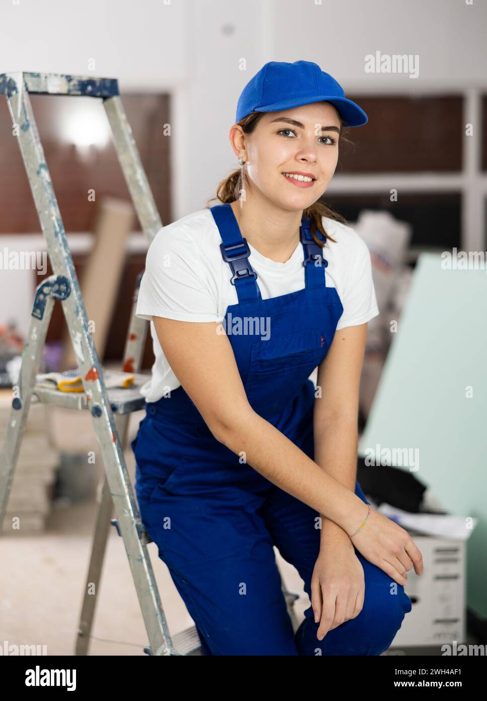 Enthusiastic young female builder inside house under construction Stock ...