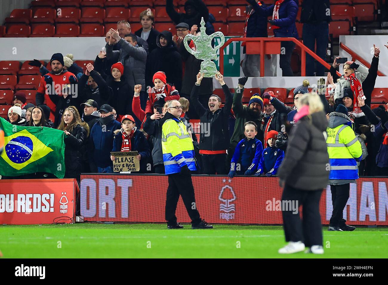 Nottingham, UK. 07th Feb, 2024. A Nottingham Forest fan holds up a foil trophy during the Nottingham Forest FC v Bristol City FC Emirates FA Cup 4th Round Replay at the City Ground, Nottingham, England, United Kingdom on 7 February 2024 Credit: Every Second Media/Alamy Live News Stock Photo