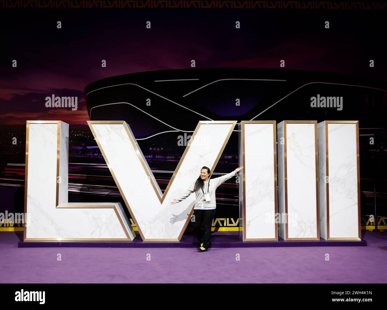 Fans take photos of the Super Bowl roman numerals at the opening of the NFL Super Bowl 