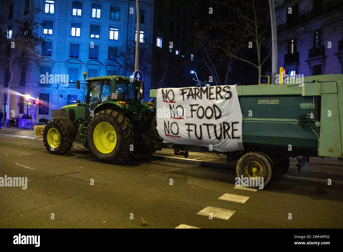 Barcelona, Spain. 7th Feb, 2024. Farmers protest against European agriculture policy. A tractor with a banner 'No farmers, no food, no future'. Stock Photo