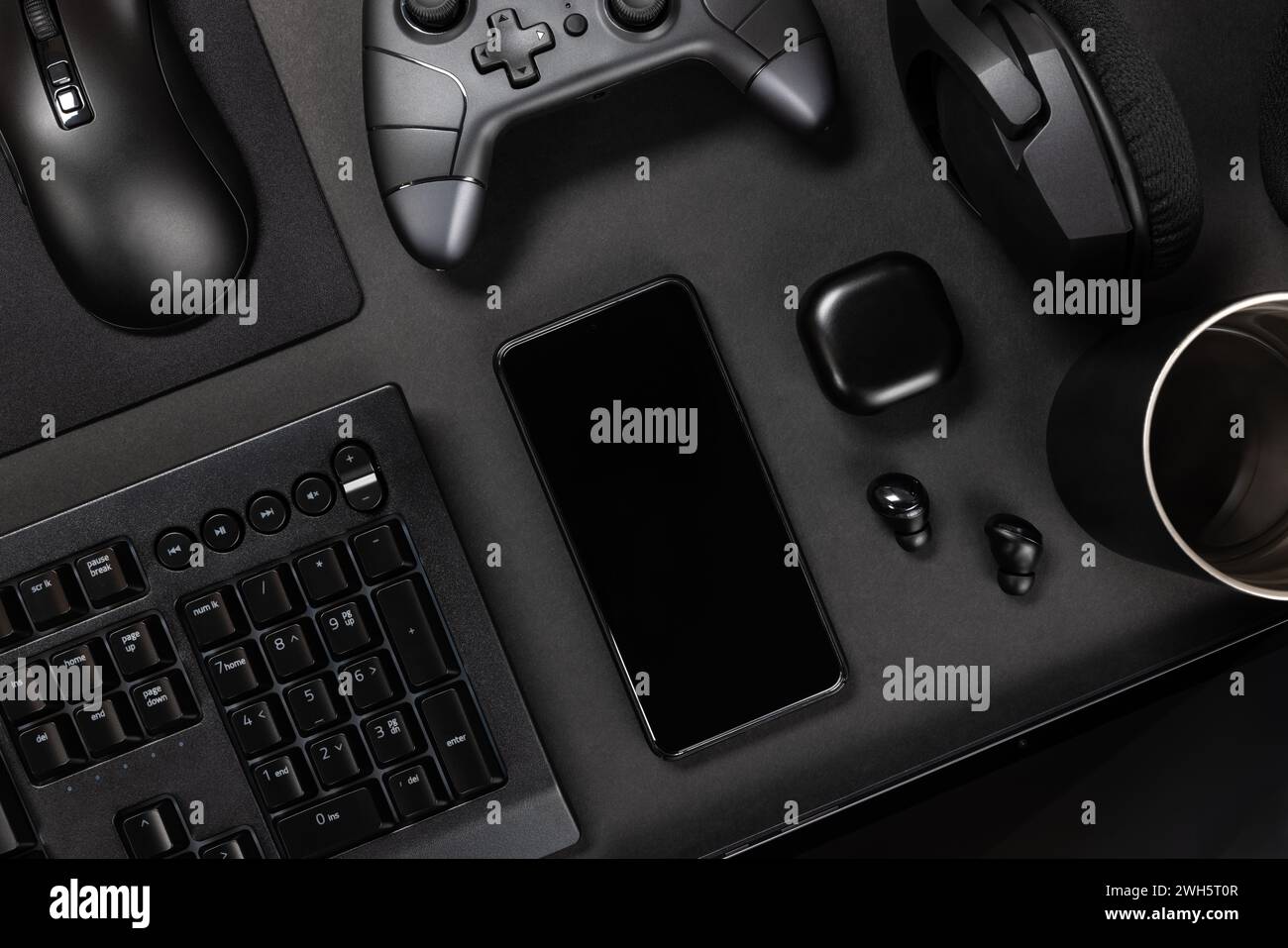 Various modern devices on black table Stock Photo