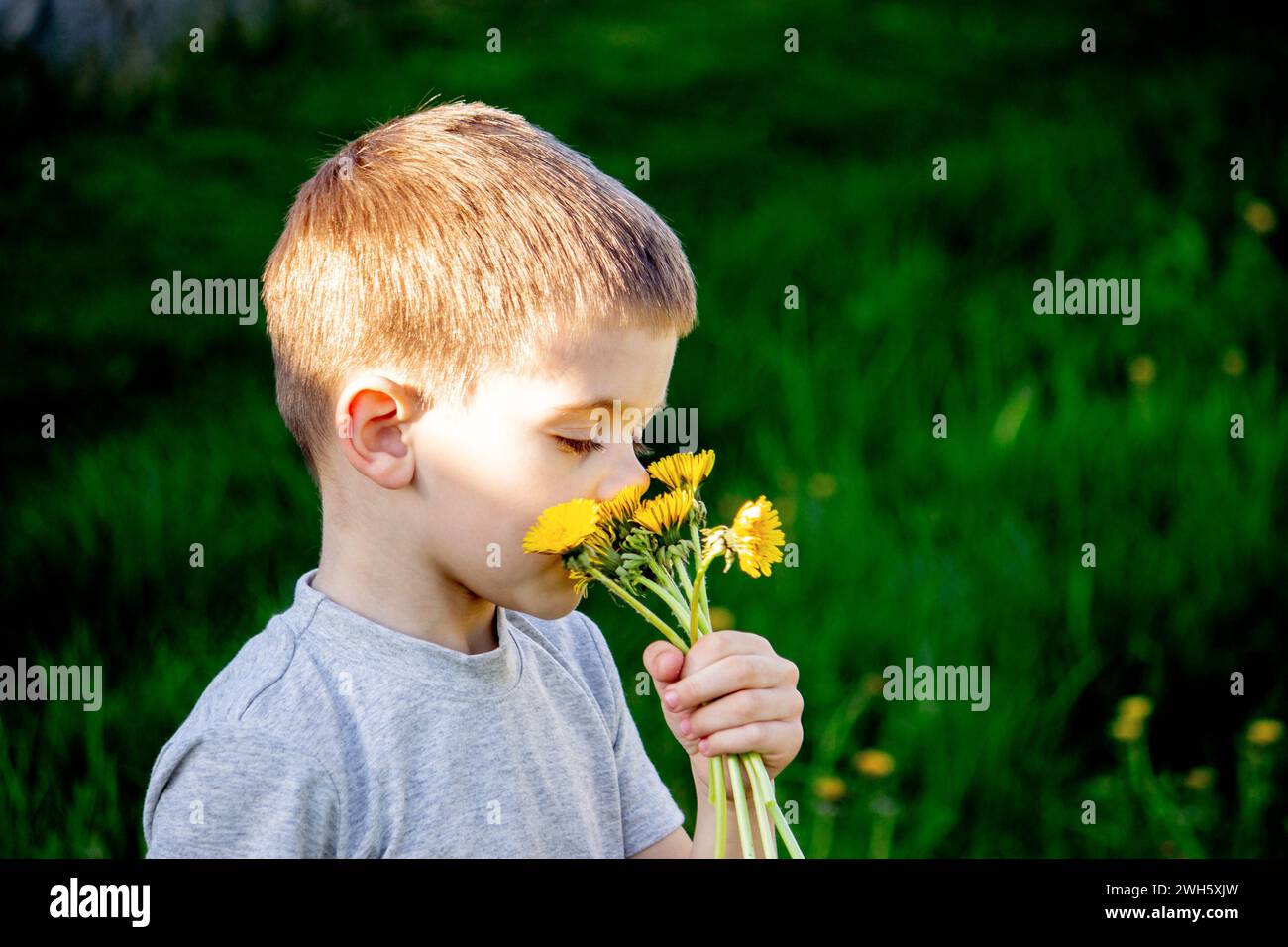 the child is allergic to spring flowers. Selective focus. Stock Photo