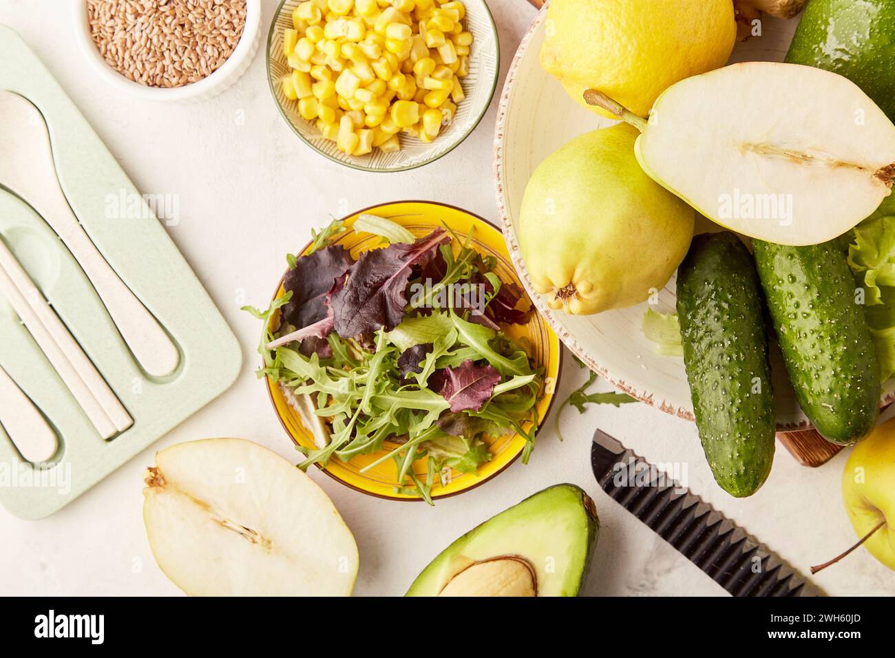 Healthy low fodmap, Mediterranean diet - vegetables, fruits, greens, flax seeds with cutlery. Plant based diet ingredients close up Stock Photo